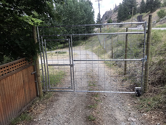 Deer fence gate with a walk through man gate